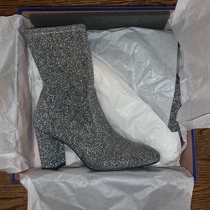Stuart Weitzman silver ankle booties.